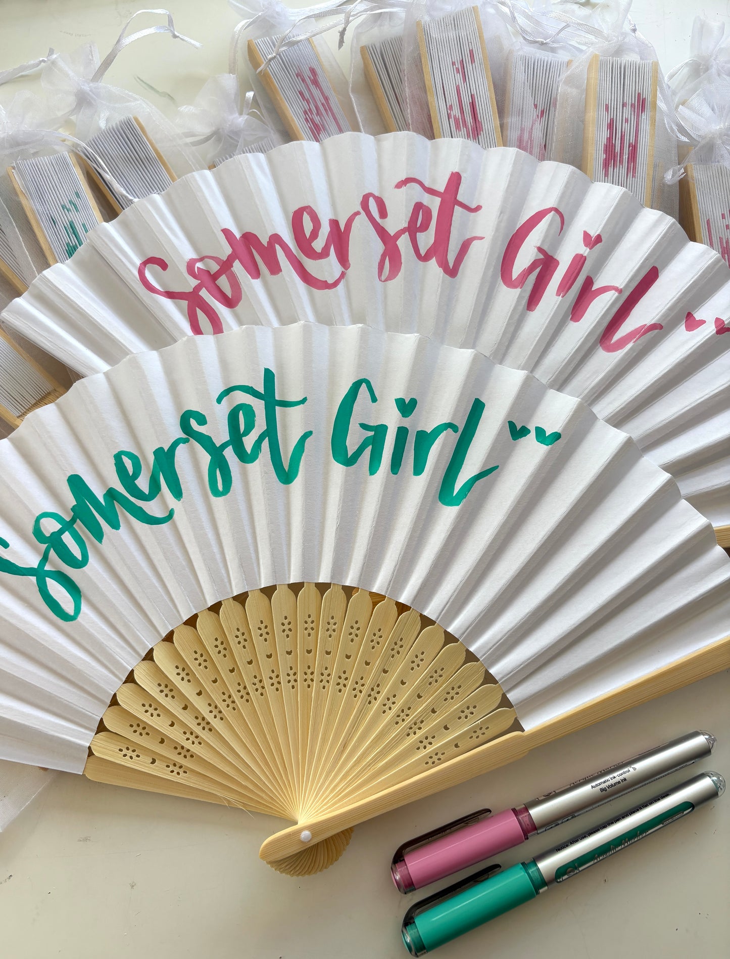 Hand-lettered paper fans