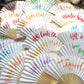 Hand-lettered paper fans