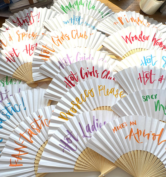 Hand-lettered paper fans